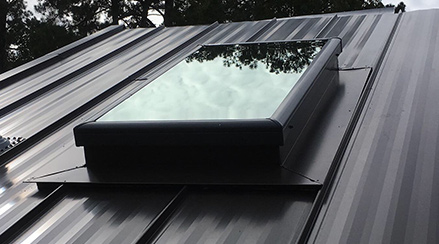 Skylights with flashing on standing seam